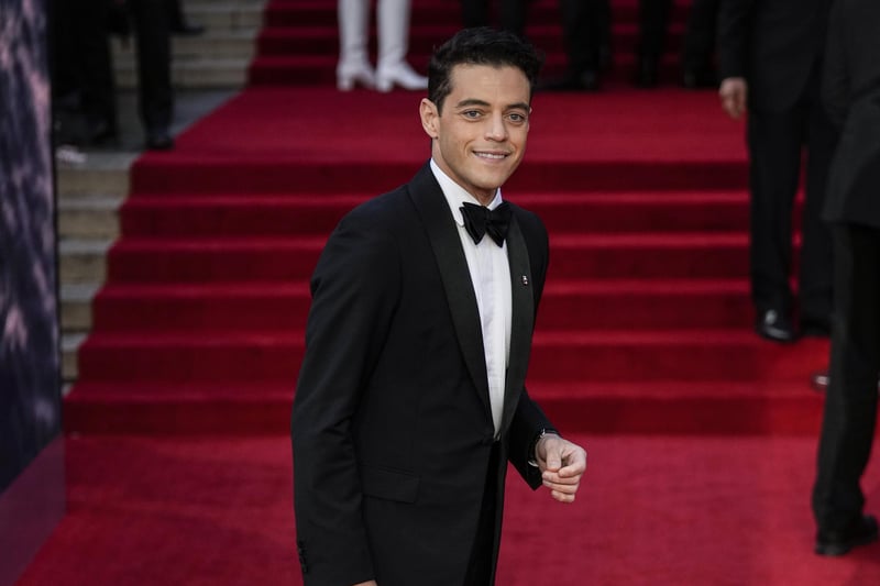 Rami Malek who is playing 007's nemesis poses for photographers upon arrival.