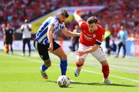 LONDON, ENGLAND - MAY 29: Callum Paterson of Sheffield Wednesday battles for possession with Nicky Cadden of Barnsley during the Sky Bet League One Play-Off Final between Barnsley and Sheffield Wednesday at Wembley Stadium on May 29, 2023 in London, England. (Photo by Richard Heathcote/Getty Images)