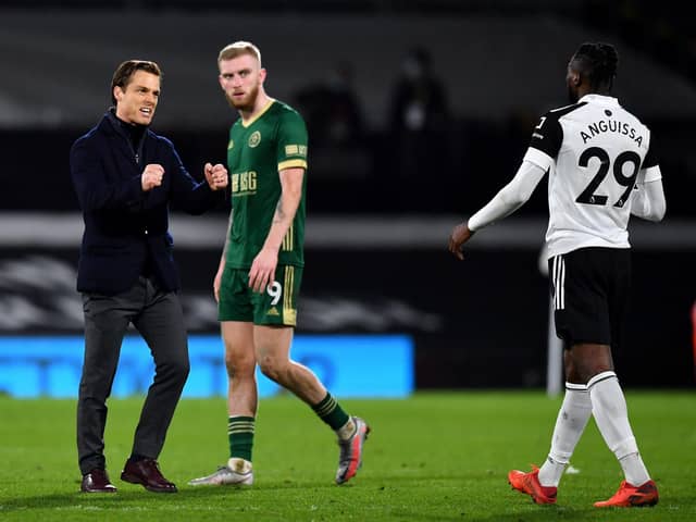 Fulham manager Scott Parker (left) celebrates victory with Andre-Frank Zambo Anguissa (right) after the Premier League match at Craven Cottage, London: Ben Stansall/PA Wire.