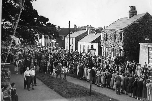 A huge crowd turned out for feast celebrations in the late 1950s. Pictured passing through the village as part of the parade were the Heortnesse Highlanders Juvenile Jazz band.