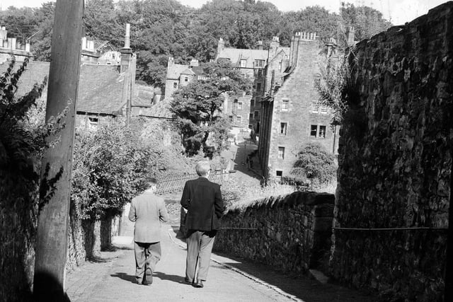 Two men have a quiet stroll through a part of Dean Village set for renovations and restorations in September 1962.