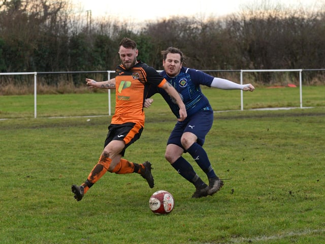 Scawthorpe’s Lee Tilley holds off his man.