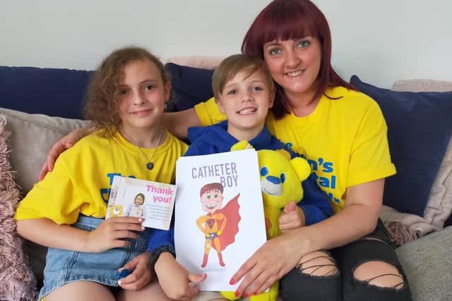 Alfie Exelby, 8, from Sheffield, with sister Nancy and mum Sarah.