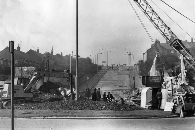 The bridge over Redwell Lane was being demolished in this photo.  The bridge used to carry the old Marsden Rattler between South Shields and Whitburn Colliery.