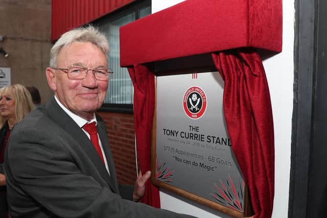 Tony Currie unveils a plaque on the South Stand, named in his honour, at Bramall Lane