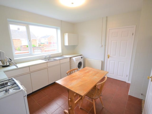 A good sized breakfast kitchen having a range of white base units with contrasting worktops, there is space for a free standing cooker, space and provisions for a washing machine, stainless steel wash bowl, two useful storage cupboards and a side door opens to the conservatory.