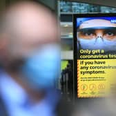 A digital display shows NHS health advice on the coronavirus displayed on October 30.  Photo by LINDSEY PARNABY/AFP via Getty Images