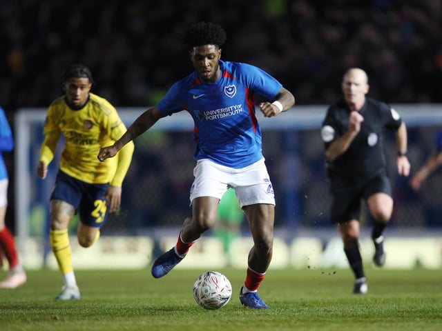Portsmouth's Ellis Harrison runs with the ball.