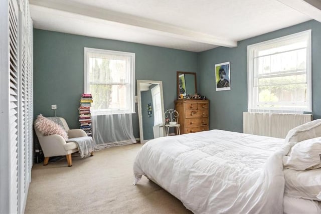 The principal bedroom has sash windows to the side and back of the property, while high ceilings also help to give a light and airy feel. In-built wardrobes provide excellent storage space.
