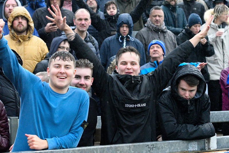 Rain-soaked supporters at Bristol Rovers during the 2019-20 season.