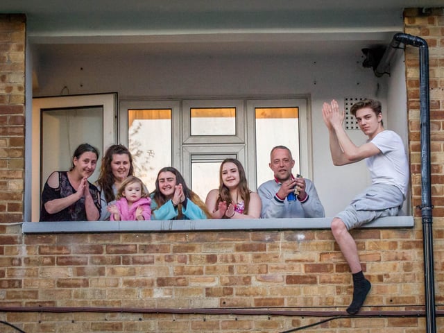 The McGuire family clapping for the NHS at their home in Grosvenor House, Southsea.