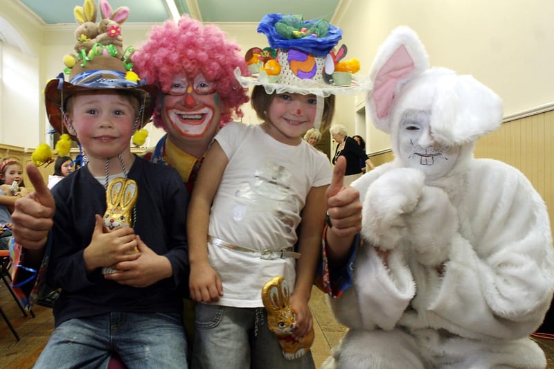 Easter bonnet prize-winners Harry Ward and Abbie Piggott with Uncle Michael the Clown at the Mayor of Bakewell's Easter party in 2007.