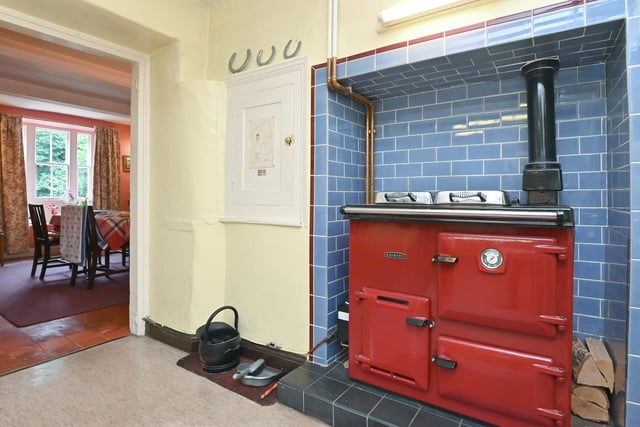 The kitchen is equipped with a classic Rayburn range cooker.