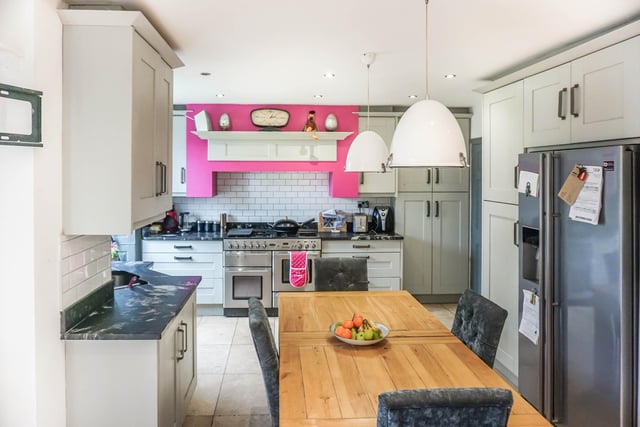 With a range of fitted appliances and lots of useful cupboards, the dining kitchen looks well-suited to family life.