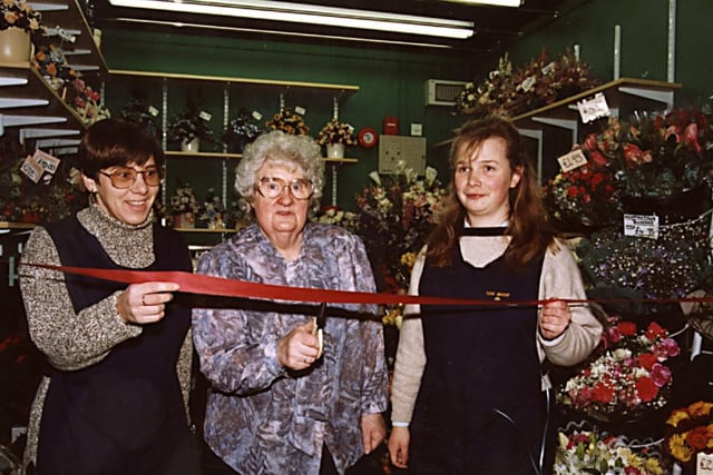 The official opening of  Tom Woods in the Frenchgate Centre in  1996, Jeanette Fish cut the ribbon watched on by  Anne Molloy and  Julie Higham