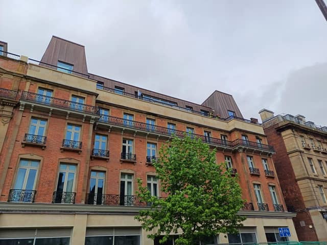 Building workers can be glimpsed on the roof terrace at the new Radisson Blu hotel in Sheffield city centre - the hotel is set to open on June 10. Picture: Julia Armstrong, LDRS