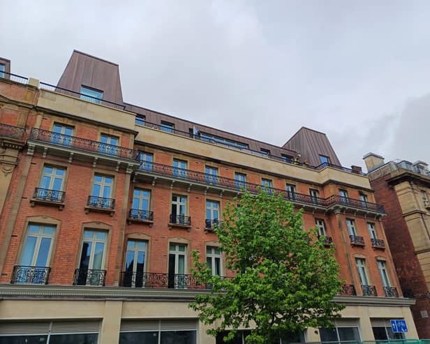 Building workers can be glimpsed on the roof terrace at the new Radisson Blu hotel in Sheffield city centre - the hotel is set to open on June 10. Picture: Julia Armstrong, LDRS