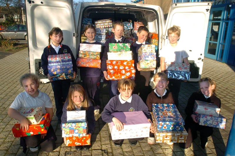 Pictured in 2004 at Birley Community Primary school, Hayfield Crescent, Sheffield, where pupils collected hundreds of gift filled shoeboxes for operation Christmas Child. Seen are pupils with some of the boxes, that were loaded into Dixon Ford van who were operating the collection service.