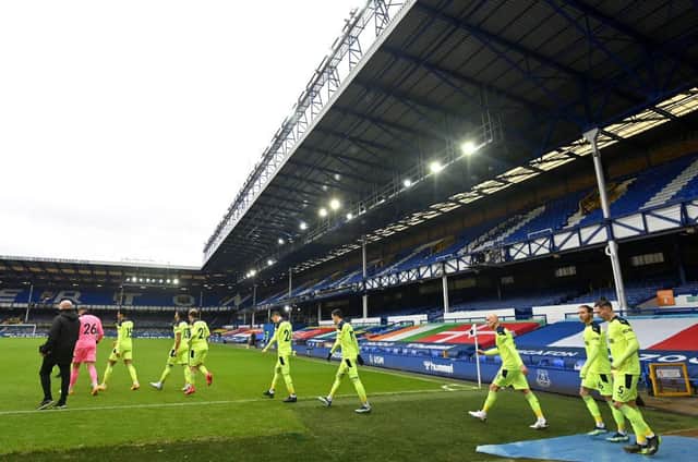 LIVERPOOL, ENGLAND - JANUARY 30: General view inside the stadium as Newcastle United players walk out to the pitch prior to the Premier League match between Everton and Newcastle United at Goodison Park on January 30, 2021 in Liverpool, England. Sporting stadiums around the UK remain under strict restrictions due to the Coronavirus Pandemic as Government social distancing laws prohibit fans inside venues resulting in games being played behind closed doors. (Photo by Paul Ellis - Pool/Getty Images)