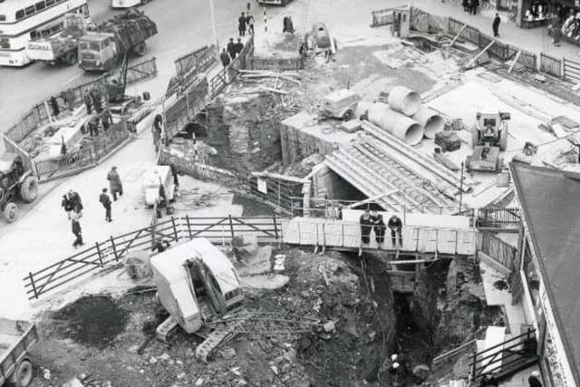 Temporary traffic and pedestrian alterations during the construction of subways for the Hole in the Road in Sheffield city centre in 1965