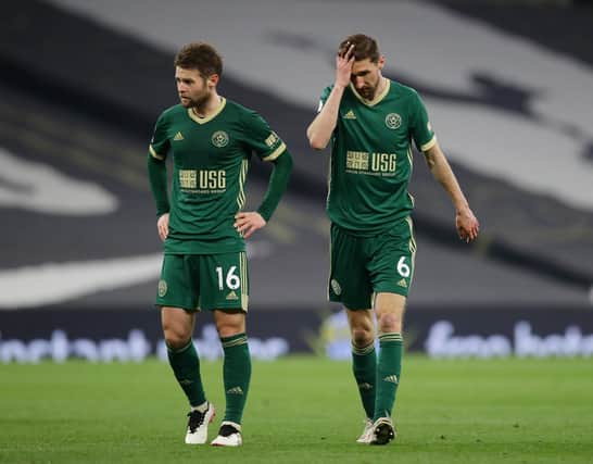 Dejected Oliver Norwood and Chris Basham of Sheffield Utd during the Premier League match at the Tottenham Hotspur Stadium, London: David Klein / Sportimage