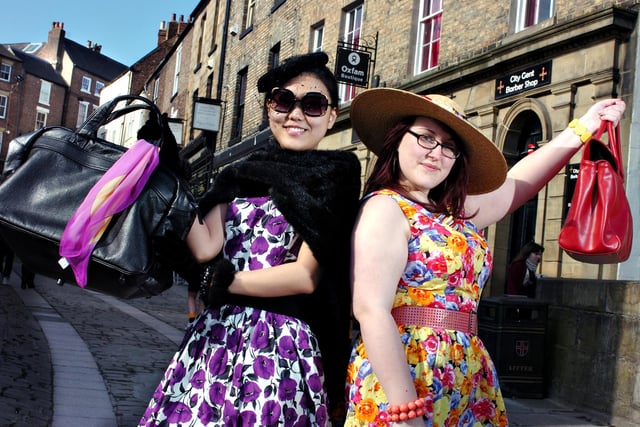 Oxfam volunteers and models Jing Ma and Sarah Brabbs in clothes from the Durham Oxfam Boutique which they planned to model at the "bit of A Do" fashion show for Women's Day nine years ago.
