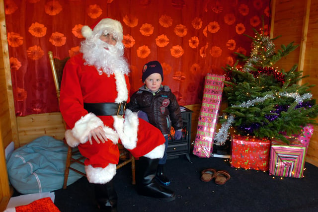 Santa with 3 year old Bradley Newton of Southwick at the grotto at Liberty Brown, Timber Beach Road, in 2012.