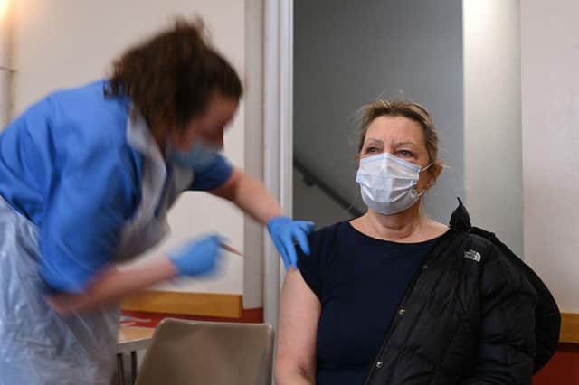 A patient is vaccinated at St Columba's church in Sheffield (Photo by OLI SCARFF/AFP via Getty Images)