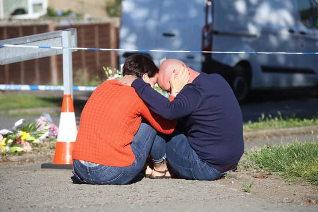 People are seen (TRYING FOR ID) at the scene at Chandos Crescent, in Derbyshire, Sep 20 2021. See SWNS story SWLEmurder; A man has been arrested and a major incident declared by police probing a murder after four people were found dead in a house. Cops made the grisly discovery on Sunday morning after being called out to a home in Killamarsh, Derbyshire, after concerns were raised about the people living there. Derbyshire Police said they were not looking for anyone else in connection with the deaths.