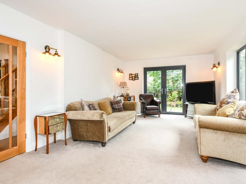 The property stands beautifully with mature trees to the front and a drive for ample vehicles including a caravan/motorhome.