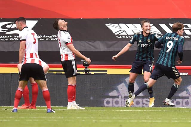 Despair for Sheffield United players as Leeds United striker Patrick Bamford celebrates his late goal which separated the two sides at Bramall Lane yesterday. Photo: Molly Darlington/NMC Pool/PA Wire.