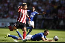Callum Robinson tackles Jonny Evans of Leicester City during the Premier League match at Bramall Lane, Sheffield on 24th August 2019. Simon Bellis/Sportimage