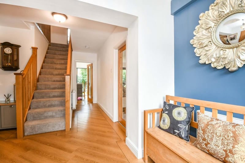 The entrance hallway has a beautiful composite front door and double-glazed window, two double radiators and lvt - luxury vinyl tiles - flooring with doors off to the living room, WC, bedroom three and the kitchen along with stairs to the first floor.