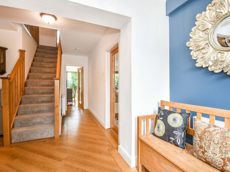The entrance hallway has a beautiful composite front door and double-glazed window, two double radiators and lvt - luxury vinyl tiles - flooring with doors off to the living room, WC, bedroom three and the kitchen along with stairs to the first floor.