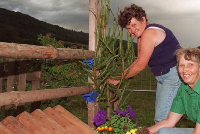 Liz gardener and Jean King put the finishing touches to a display in 1996