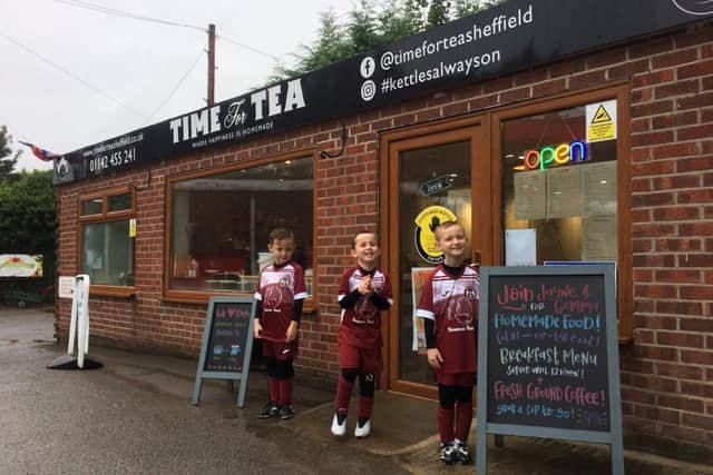L-R: players Milo Fowler, and Rocco Parr and Alfie West (Jayne's nephews), pictured outside Time for Tea.