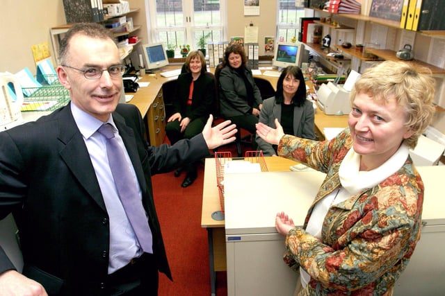 Taylor & Emmet's John Outram officially handed over the office equipment to Lady Manners' head teacher, Mary Sellers in 2004