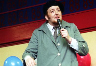 Simon Touhig taking to the stage as Frank Spencer at the 1997 Mecca Bingo talent show