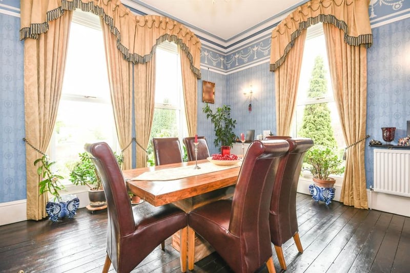 The well-appointed, double-aspect dining room offers a lovely place for family dining and entertaining, and features an open fireplace, a central heating radiator and coving to the ceiling. It is finished with front and side-facing, full-length PVCu double-glazed windows.