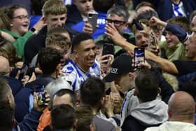 COMEBACK HERO: Liam Palmer celebrates with Sheffield Wednesday fans after Peterborough United are beaten in a penalty shoot-out