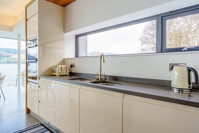The modern kitchen is well equipped and is part of the open-plan living area.