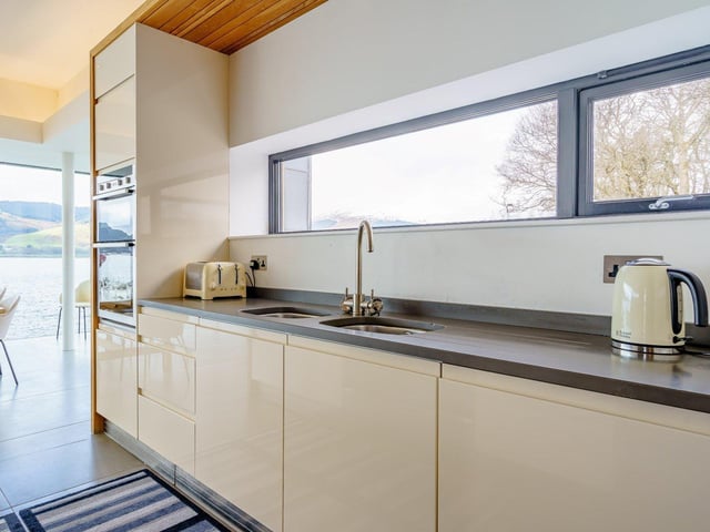 The modern kitchen is well equipped and is part of the open-plan living area.