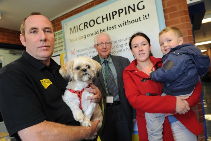 A Dog's Trust dog microchipping event at Lukes Lane Community Centre in 2015. Dog's Trust's David Kelly, Coun Alan Kerr, Stephanie and Riley Adams are in the picture and right at the front is Harley the dog.