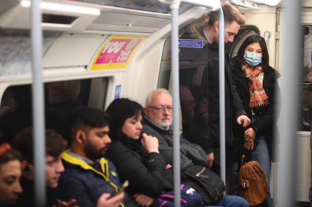 A woman on the Jubilee line of the London Underground tube network wearing a protective facemask on the day that Health Secretary Matt Hancock said that the number of people diagnosed with coronavirus in the UK has risen to 51. Victoria Jones/ PA Wire