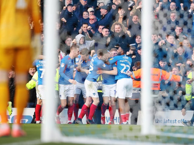 James Bolton celebrates in front of fans in the North Stand following his goal against Sunderland.