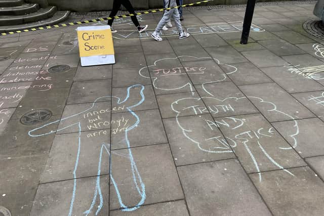 Sheffield street tree protesters chalked up their response to the Lowcock inquiry report outside Sheffield Town Hall