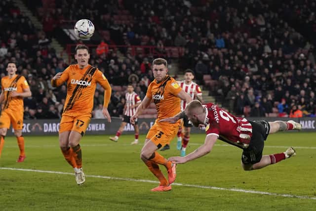 Oli McBurnie's effort here was appreciated by the Sheffield United fans at Bramall Lane for their team's game against Hull City: Andrew Yates / Sportimage