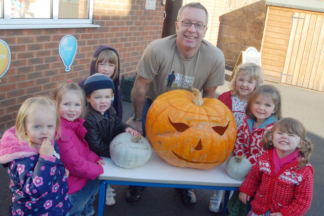 Youngsters who attend the Bright Sparks Nursery on Derby Road, meet up with their giant Halloween, pumpkin donated and carved for them by Graham Parker, who gave it to them in thanks for their fund raising efforts via a bake sale in aid of the Mansfield Heroes fund.