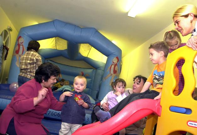 Bouncy castle and slide for toddlers in 2002 at Grove Gardens.