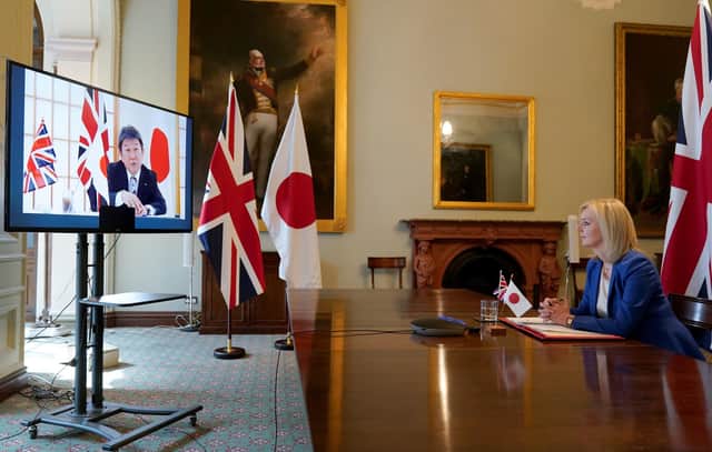 Secretary of State for International Trade Liz Truss speaks to Japan’s Minister for Foreign Affairs Toshimitsu Motegi. Picture by Andrew Parsons / No 10 Downing Street